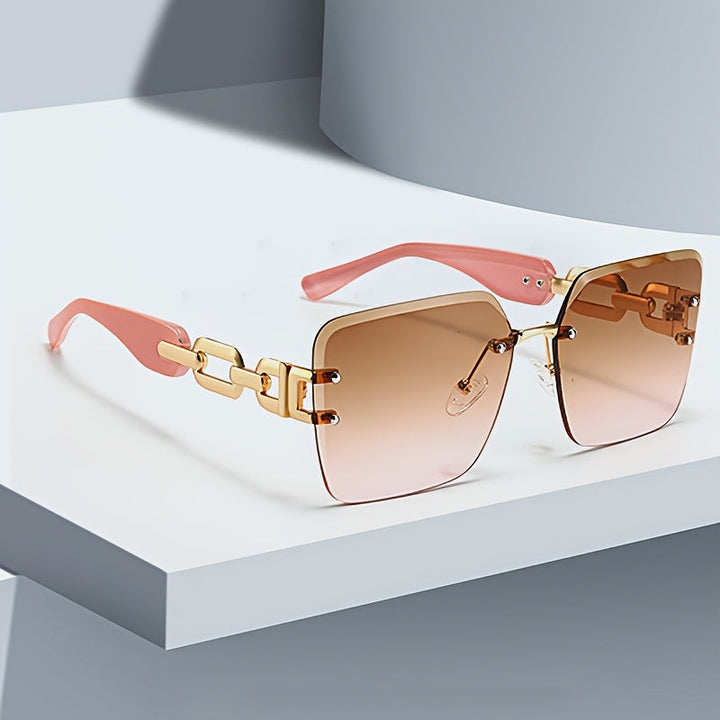 Close-up of women's rimless square sunglasses, highlighting the intricate chain link side detail.