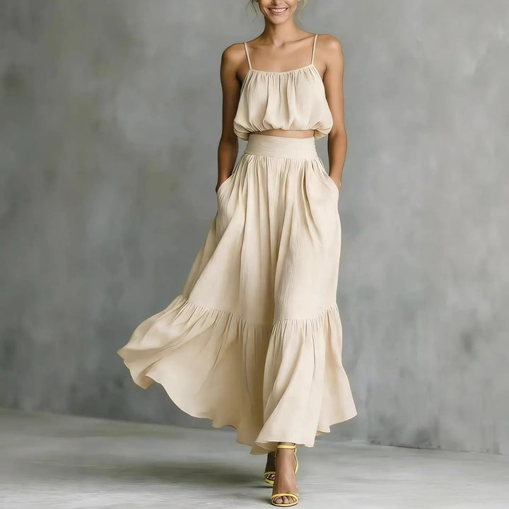 Elegant women's coordinated crop top and ruffle maxi skirt set, ideal casual vacation and holiday fashion.