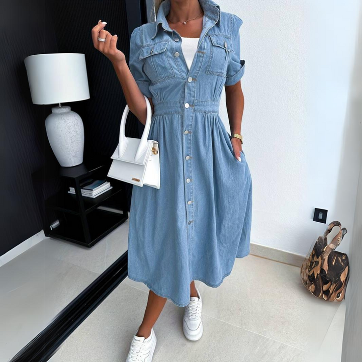 Fashionable women's short sleeve denim shirt dress, ideal for a chic spring or summer casual look.