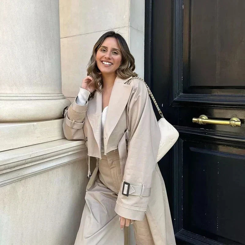 High-quality women's short trench coat with belt, a timeless and versatile fashion choice.
