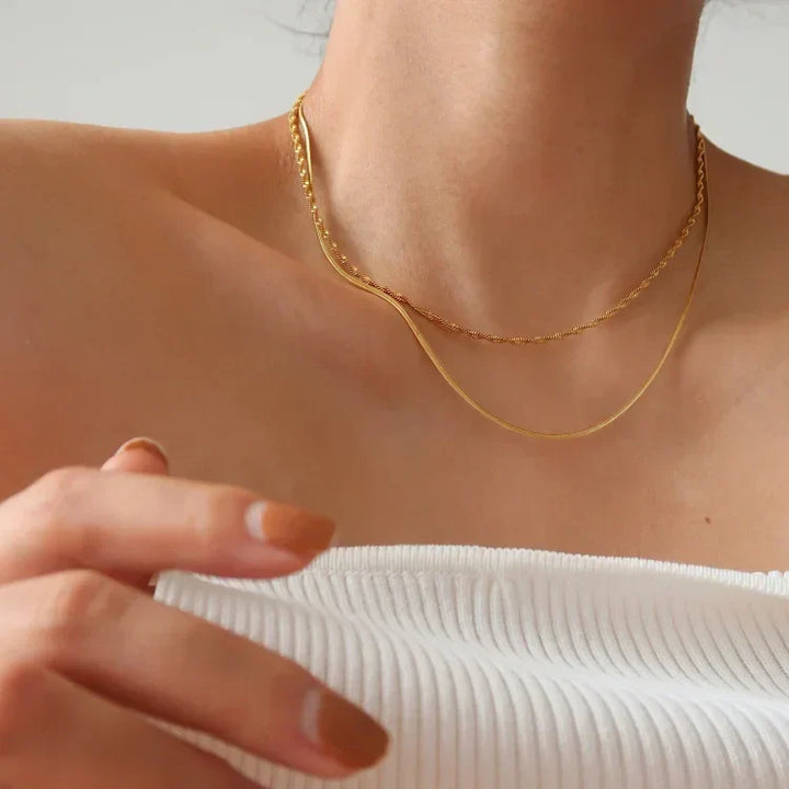 Slim & stylish women's snake chain necklace in gold plated or sterling silver, a versatile jewelry gift.