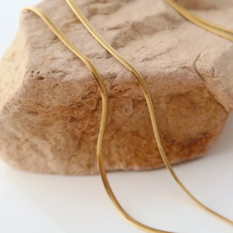 Isis women's elegant snake chain necklace, a slim gold plated design perfect for any occasion.
