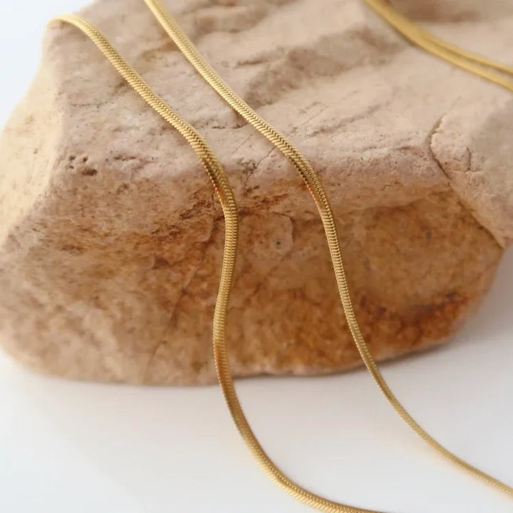 Isis women's elegant snake chain necklace, a slim gold plated design perfect for any occasion.