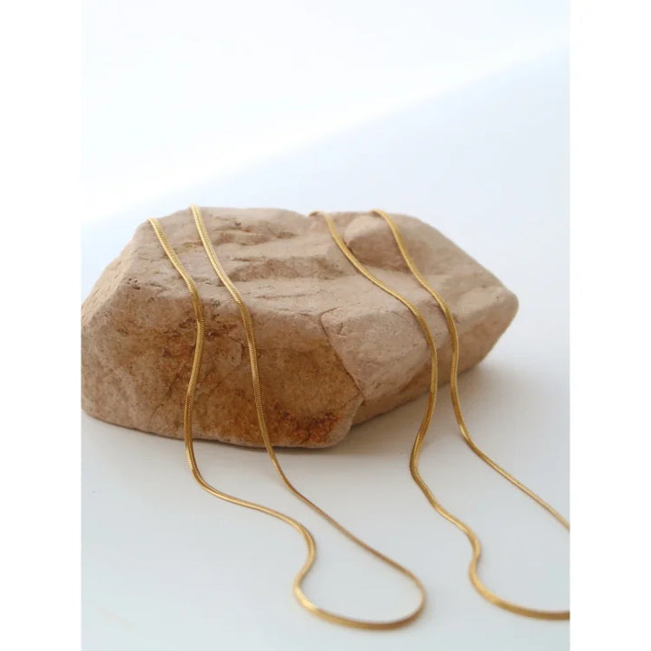 Minimalist women's sterling silver snake chain necklace, a stylish slim chain for everyday elegance.