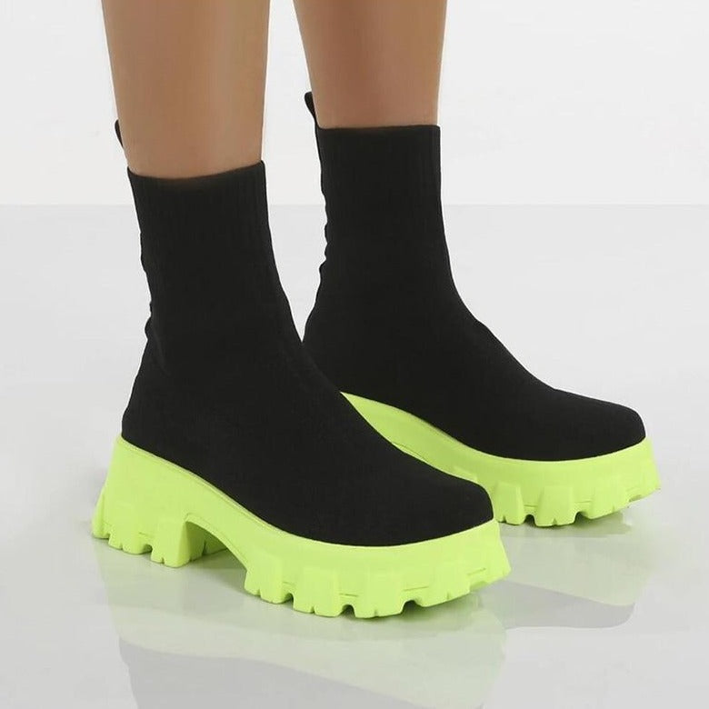 Chic black women's slip-on ankle boots, Paris style, offering comfortable and versatile fashion footwear.