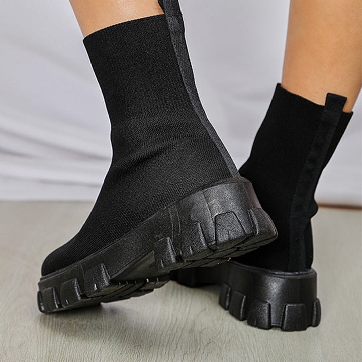 Modern women's slip-on ankle boots, Paris style, offering sleek design and comfortable wear for any occasion.