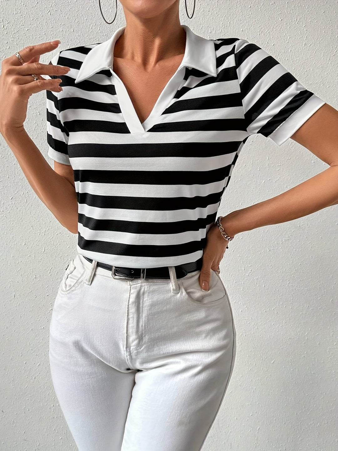 Comfortable women's striped short sleeve t-shirt with a stylish collar, great for classic casual looks.