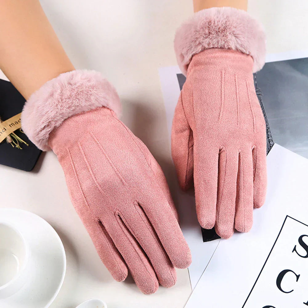 Elegant women's suede gloves featuring a soft faux fur lining & touchscreen fingertips for winter.