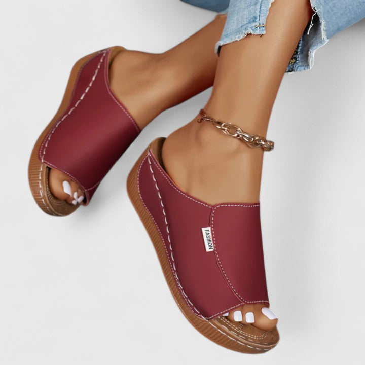 Close-up of women's comfortable open-toe summer sandals, showcasing elegant design & quality.