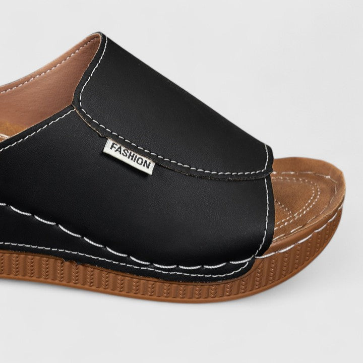 Pair of women's comfortable summer sandals in a beautiful color, designed for stylish all-day wear.
