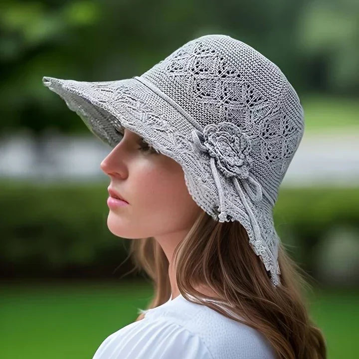 Wide brim women's beach hat with delicate lace, ideal for sun protection on summer holidays.