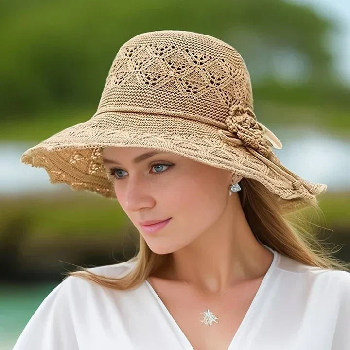 Foldable women's sun hat with lace detail, a chic and practical summer travel accessory.
