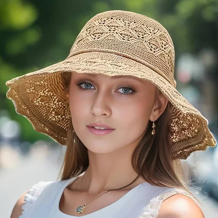 Elegant women's lace sun hat, a chic wide brim accessory for beachwear and summer outfits.