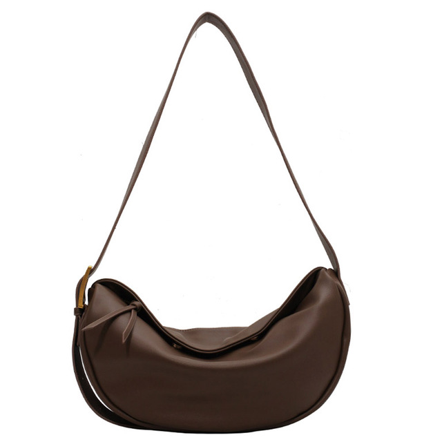 Women's stylish vegan leather crossbody handbag with adjustable strap. Perfect fashion accessory for everyday use.