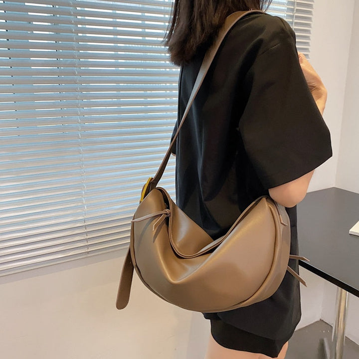 Everyday women's vegan leather crossbody bag. Stylish, comfortable, and practical shoulder handbag accessory.