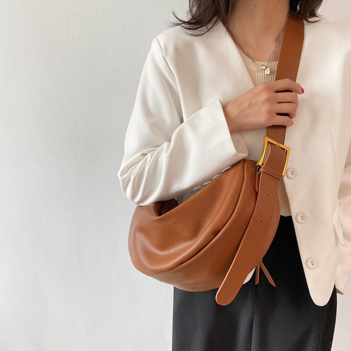 Fashionable women's vegan leather handbag, designed as a stylish and versatile crossbody accessory.