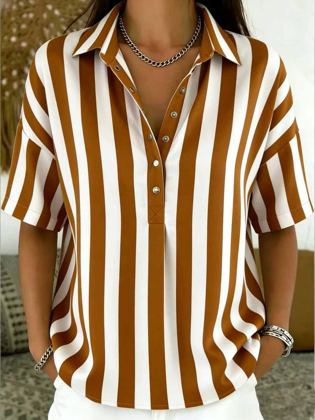 Summer-ready women's half-button shirt with a classic vertical stripe pattern, versatile and chic.