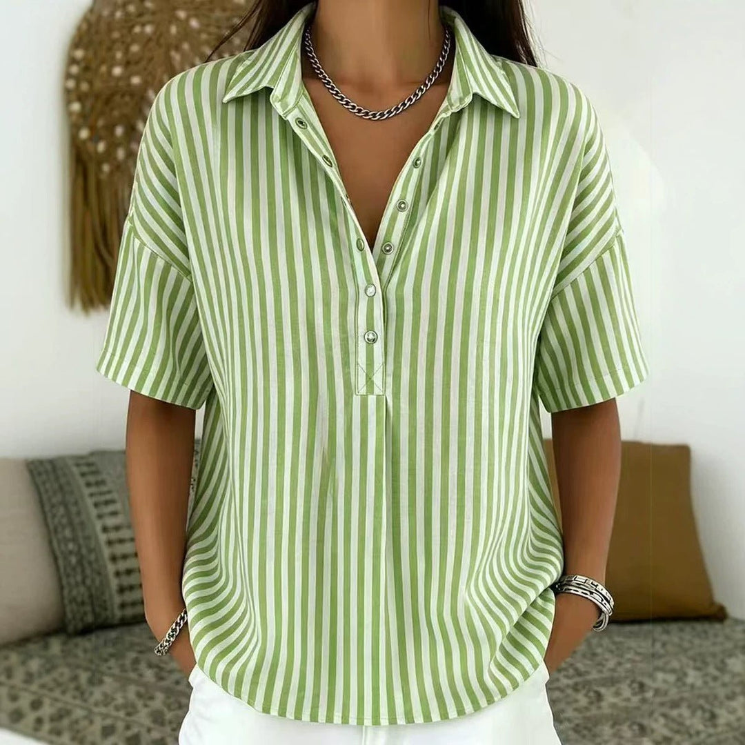 Elegant women's blouse with vertical stripes and a half-button placket, ideal for spring fashion.