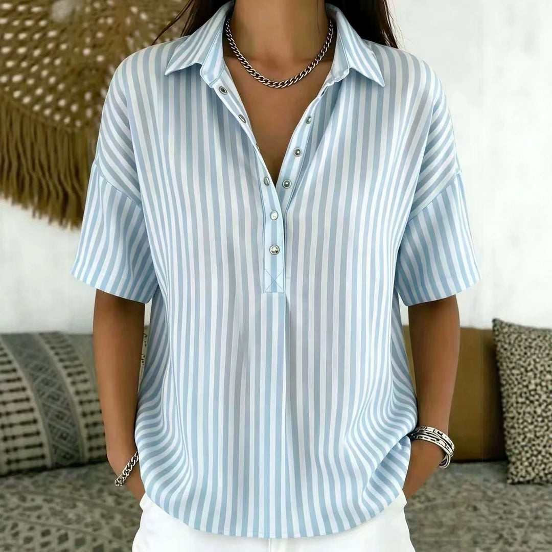 Fashionable women's half-button blouse in a vertical stripe pattern, perfect for spring/summer style.