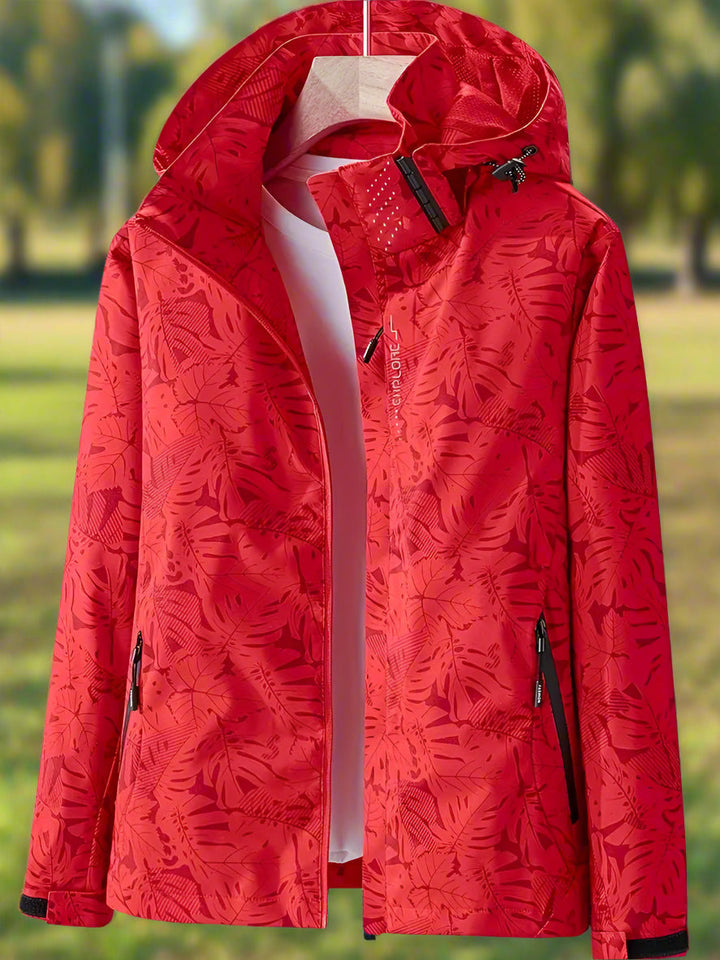 Lightweight women's waterproof summer jacket. Trendy leaf print design, ideal for stylish rain protection & outdoor wear.