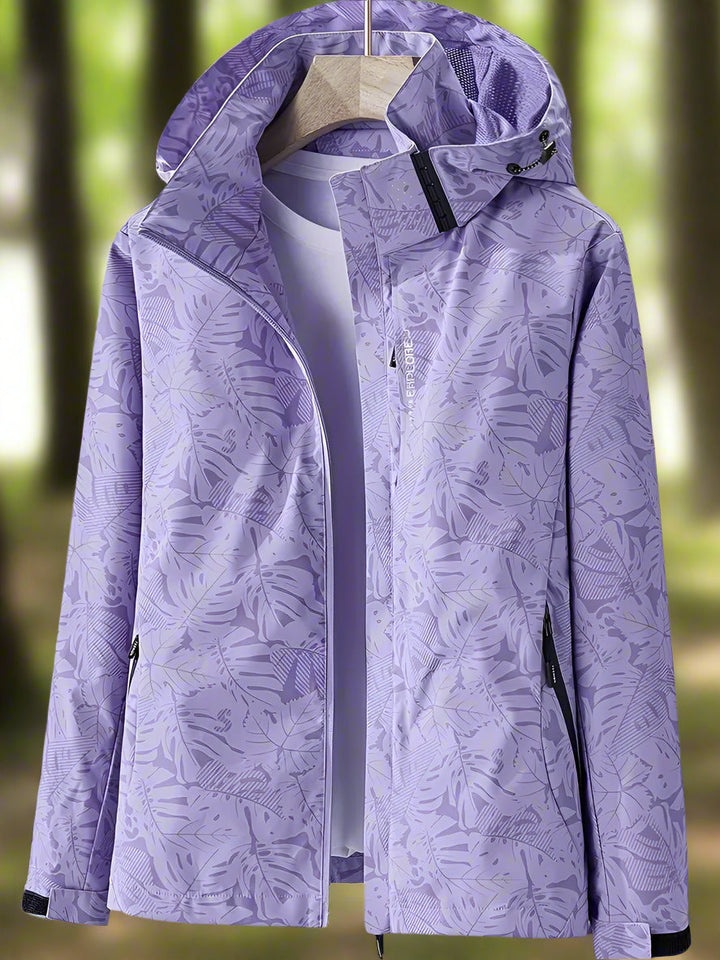Chic women's waterproof summer jacket featuring an eye-catching leaf print. Stay dry and stylish in any weather.