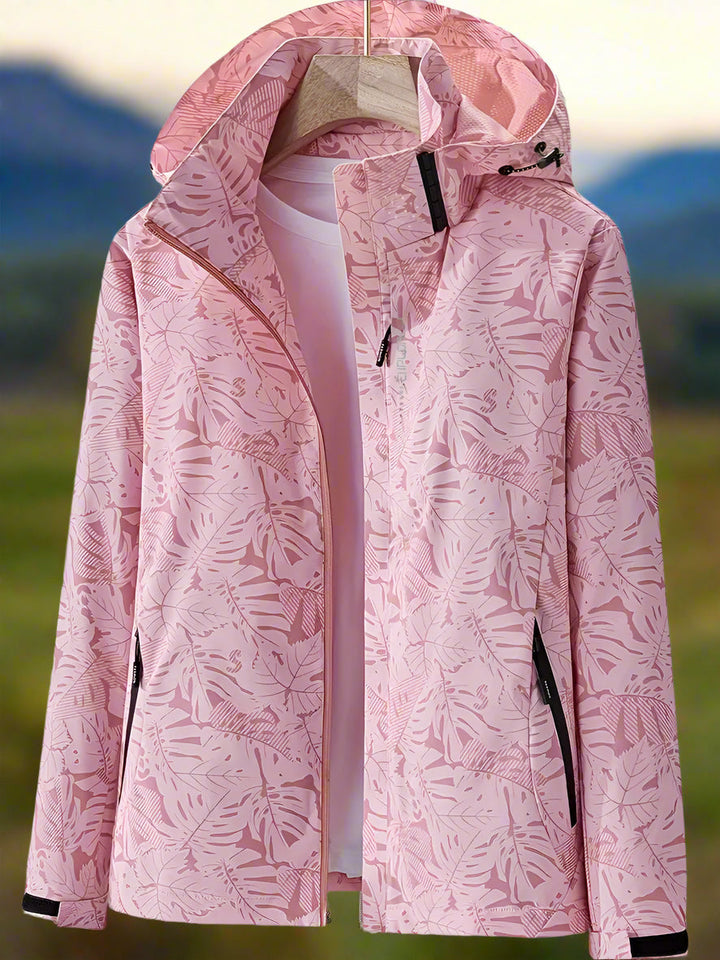 Women's outdoor waterproof jacket. Summer-ready with a fresh leaf print, lightweight and practical for all activities.