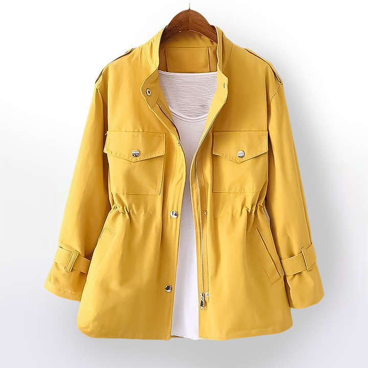 Stylish women's spring rain jacket. Waterproof outerwear with a flattering cinched waist for a chic look.