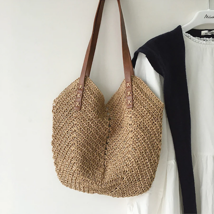Chic brown woven shoulder bag for women, a versatile everyday carry accessory.