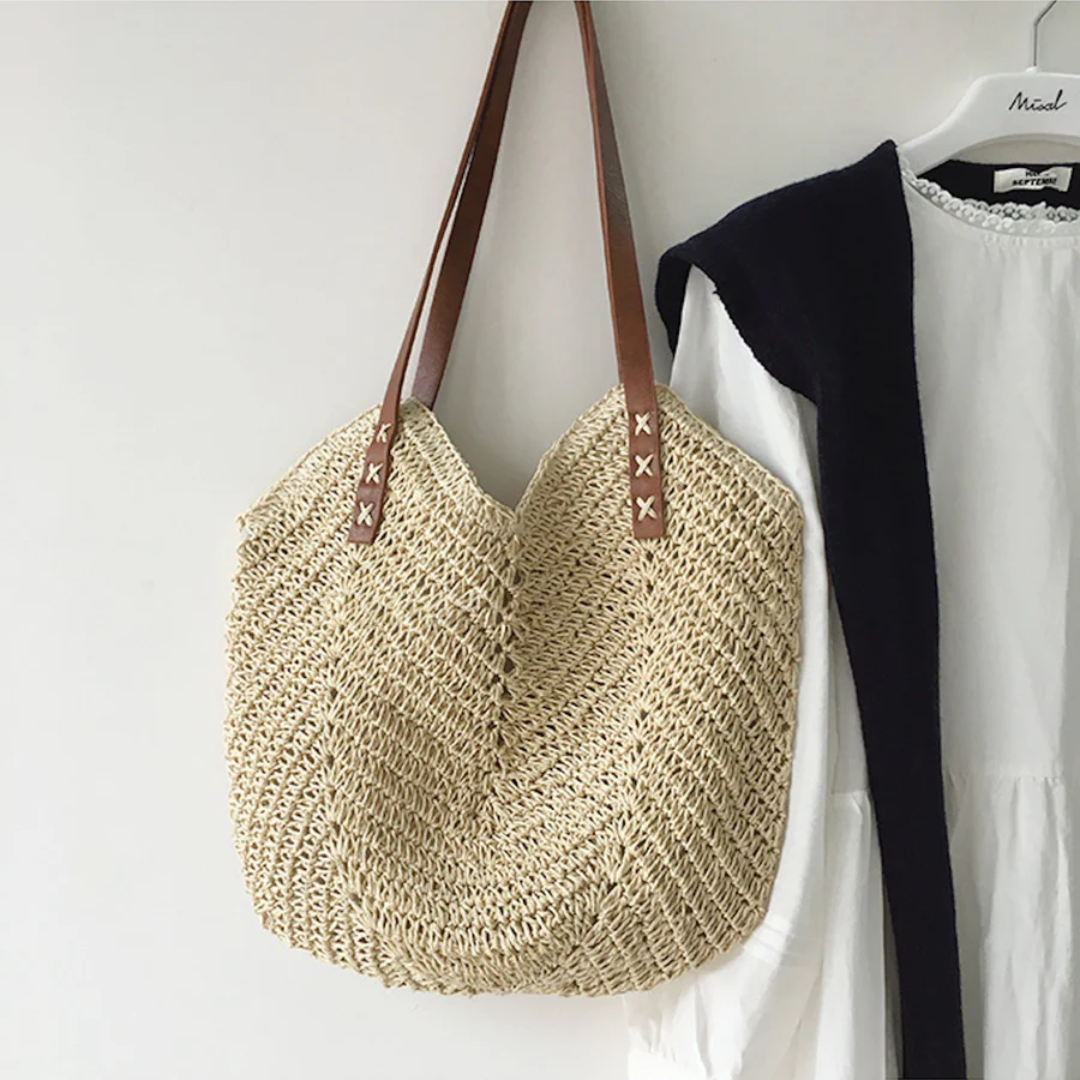 Woman carrying a stylish white woven shoulder bag, perfect for everyday casual fashion.