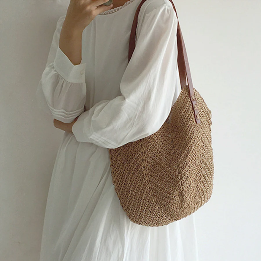 Close-up of a BreezeWoven white woven shoulder bag, highlighting its unique texture & stylish design.