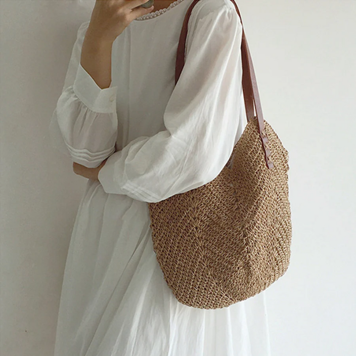 Close-up of a BreezeWoven white woven shoulder bag, highlighting its unique texture & stylish design.