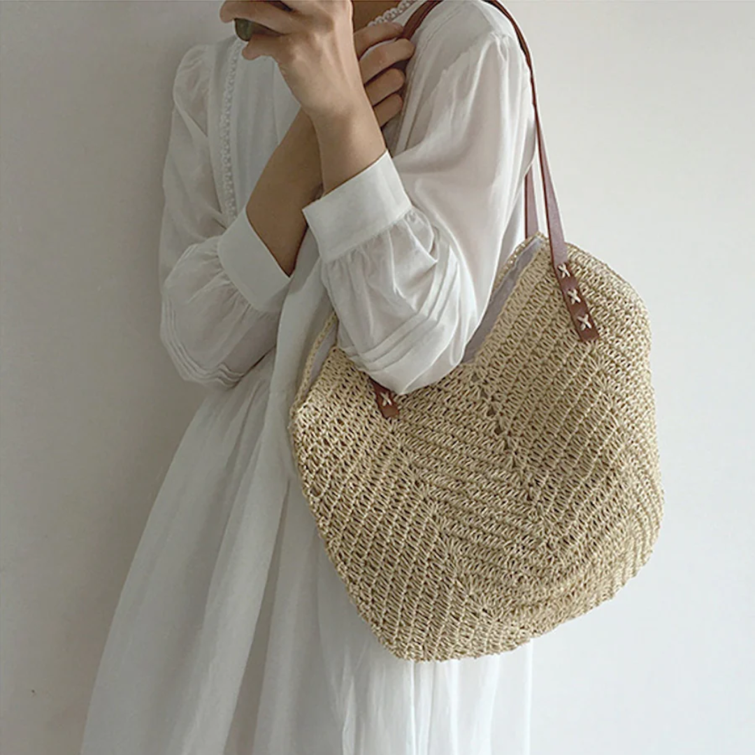 Versatile women's stylish woven shoulder bag in white, great for casual everyday fashion.