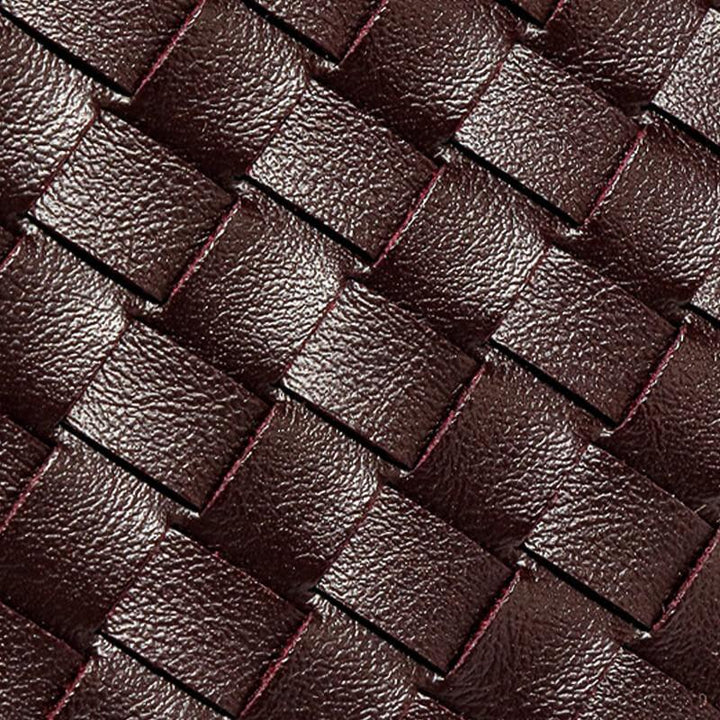 Women's compact faux leather woven bag, perfect for a minimalist stylish look.