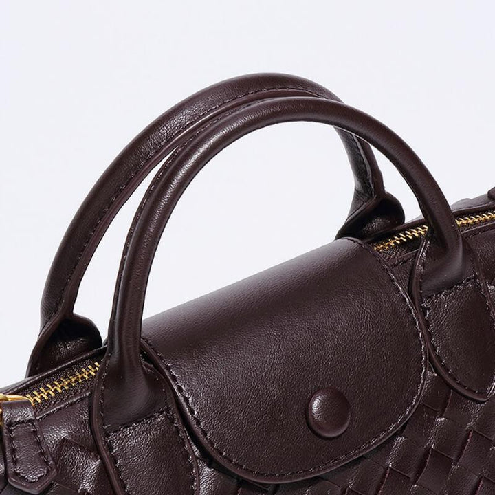 Trendy woven mini shoulder bag for women, featuring a durable faux leather finish.