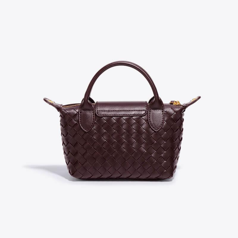 Modern women's mini bag, unique handcrafted look woven pattern, versatile shoulder carry.