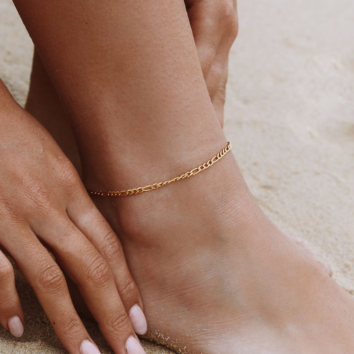 Women's subtle Amalfi Figaro ankle bracelet, a dainty gold or silver anklet. Perfect summer jewelry accessory.