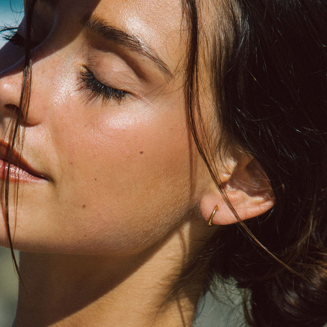 Gold mini hoop earrings for women, hypoallergenic & stylish.