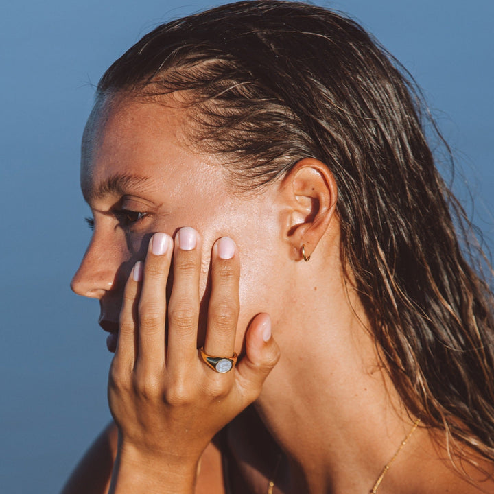 Everyday dainty mini hoop earrings, available in gold and silver for women.