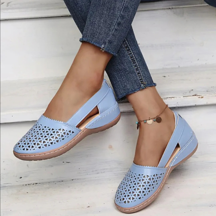 Elegant women's summer shoes, orthopedic for all-day comfort. Features a breathable cutout slip-on design.