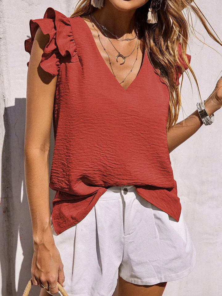 Fashionable women's top, a versatile summer blouse with playful ruffle sleeves & a sophisticated V-neck design.