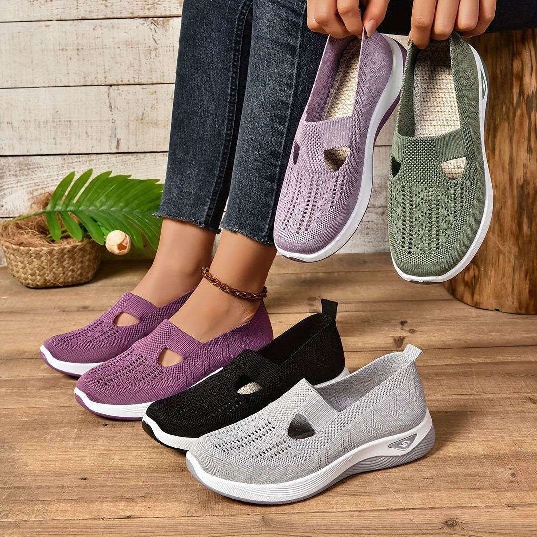 Women's supportive black slip-on shoes for all-day comfort & easy wear.