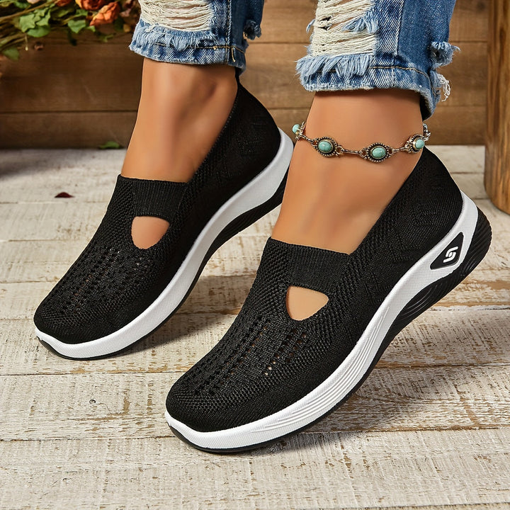 Detailed shot of the sole of supportive women's walking shoes, ensuring comfort & grip.