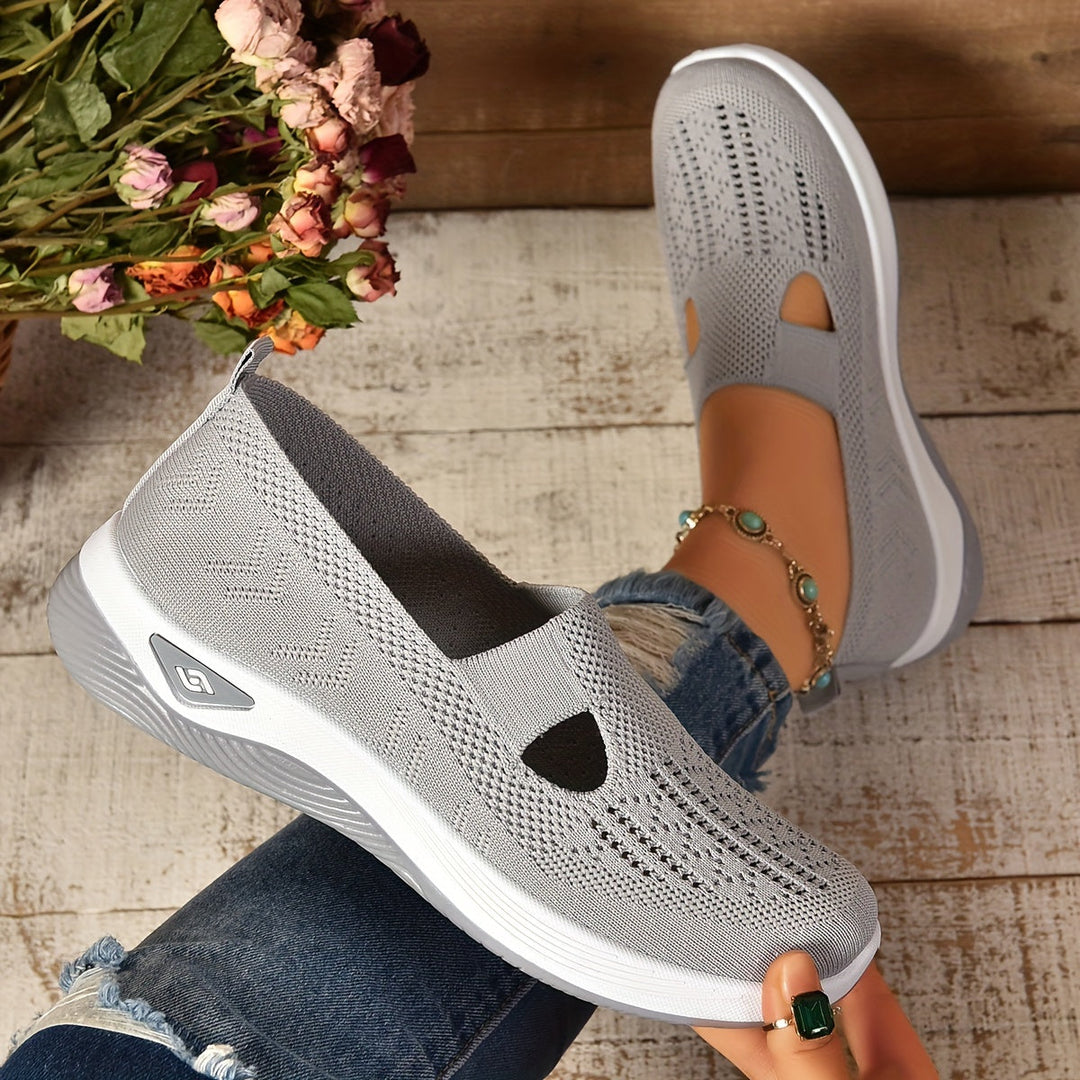 Side view of women's supportive footwear, a slip-on style for casual and active wear.