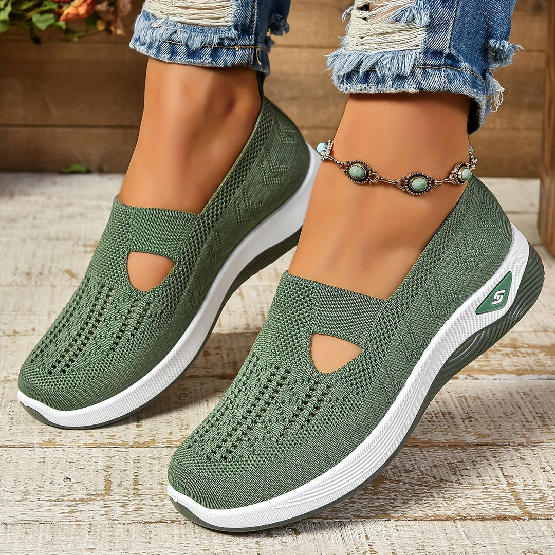 Women's casual slip-on shoes in navy, providing ergonomic foot support & all-day comfort.