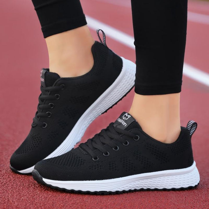 Lace-up women's walking shoes, orthopedic support, breathable for everyday foot relief.