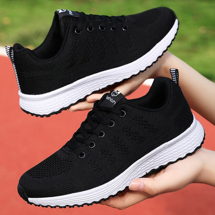 Supportive women's walking shoes, orthopedic design for foot pain relief & daily wear.