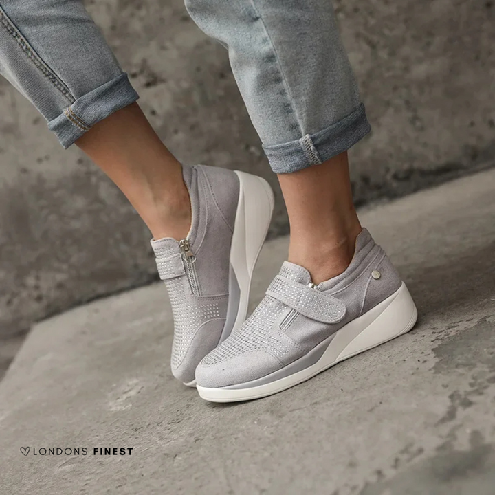 Lightweight women's casual sneakers with comfortable cushioned insoles and supportive design for daily wear.