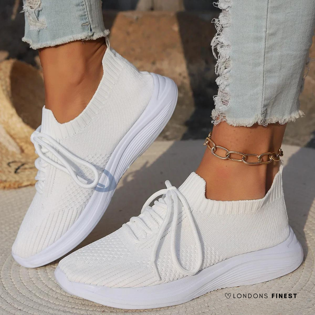 Women's supportive walking sneakers with breathable mesh upper for everyday comfort and foot health. Lightweight athletic design.