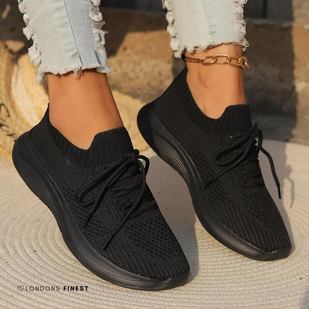 Gray women's casual sneakers offering supportive, breathable comfort for daily wear. Lightweight walking and athletic footwear.