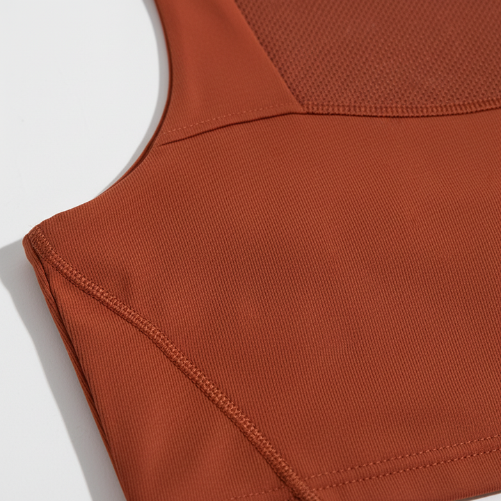 Moisture-wicking women's sports top with stretch fit, offering great support & comfort.